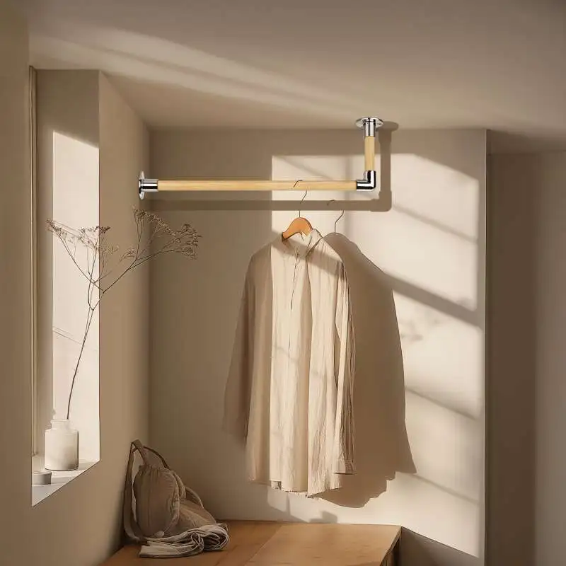 Maßgefertigte Edelstahl-L-förmige Garderobenstange Holzstab, montiert in einem stilvollen Raum mit Kleidung, die an der Stange hängt.